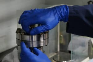 A technician preparing an ALD tool used in semiconductor coatings
